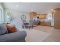 Inviting living area featuring a cozy sofa, dining table, and a kitchen with stainless steel appliances at 1050 Bruce St, Pahrump, NV 89048