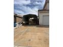 Adjacent to the home is a spacious car port on a concrete drive at 128 Appian Way, Henderson, NV 89002