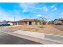 Charming single-story home featuring a low maintenance front yard and a two-car garage at 1356 Spague St, Henderson, NV 89011