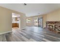 Inviting living room with new flooring and a cozy brick fireplace at 1356 Spague St, Henderson, NV 89011