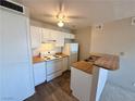 The well-lit kitchen features wooden countertops and ample cabinet space at 1381 E University Ave # 310, Las Vegas, NV 89119