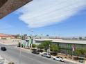 A bright street view showcasing the community with green doors and landscaping at 1381 E University Ave # 310, Las Vegas, NV 89119