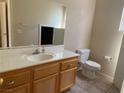 Bathroom featuring a vanity with a mirror, sink and a toilet at 1434 Summer Glow Ave, Henderson, NV 89012