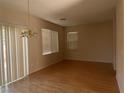 Bright living room features hardwood floors, neutral walls, and large windows at 1434 Summer Glow Ave, Henderson, NV 89012