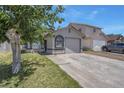 Cozy single-story home featuring a stucco facade, arched windows, a lush lawn, and a one-car garage at 1622 Lorna Dr, Henderson, NV 89011