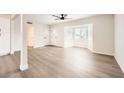 Bright living room features modern flooring, ample natural light, and a contemporary ceiling fan at 1829 E Saint Louis Ave, Las Vegas, NV 89104