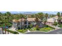 Beautiful view of a two-story house featuring manicured lawns and palm trees at 1931 Pago Ct, Las Vegas, NV 89117