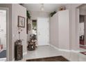 Bright foyer featuring tile flooring and a view of the front door at 3522 Shonna Way, North Las Vegas, NV 89032