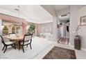 Open-concept living room and dining area with plush carpeting at 3522 Shonna Way, North Las Vegas, NV 89032