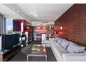 Inviting living room boasts modern fireplace, comfortable seating, and sleek bar area for relaxation at 4381 W Flamingo Rd # 2122, Las Vegas, NV 89103