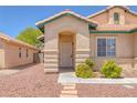 Charming single-story home with a welcoming front entrance and desert landscaping at 4619 Reliant St, North Las Vegas, NV 89031