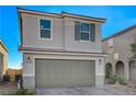Attractive two-story home with a two-car garage, neutral color scheme, and neatly paved driveway at 4977 Birchland Manor Ave, Las Vegas, NV 89139