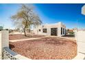 Charming single story home featuring a unique architectural style and desert landscaping at 603 W Adams Ave, Las Vegas, NV 89106
