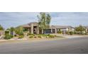 Attractive single-story home with a three-car garage, xeriscaping, and combination driveway at 6060 N Conquistador St, Las Vegas, NV 89149