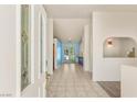 Bright foyer with tiled floors leading to a naturally lit area and glass doors to the backyard at 7110 La Cienega St, Las Vegas, NV 89119