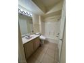 Bright bathroom with tile floors, vanity, toilet, and shower over tub at 7159 S Durango Dr # 206, Las Vegas, NV 89113