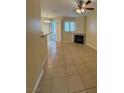 Spacious living room with tile flooring, fireplace, and sliding door at 7159 S Durango Dr # 206, Las Vegas, NV 89113