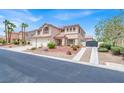 Beautiful two-story home with meticulously landscaped front yard and a two-car garage at 7310 Heggie Ave, Las Vegas, NV 89131