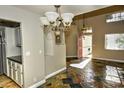 Inviting living room features stone floors, light fixtures, and large windows for natural light at 7429 Fencerow St, Las Vegas, NV 89131