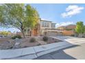 Charming two-story home with stone accents, three-car garage, and landscaped front yard at 7778 Villa Montara St, Las Vegas, NV 89123
