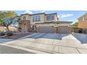Attractive two-story home with a stone-accented facade and a spacious three-car garage at 7778 Villa Montara St, Las Vegas, NV 89123
