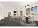 Inviting living room with fireplace, ceiling fan and open layout dining area at 913 Duckhorn Ct # 204, Las Vegas, NV 89144