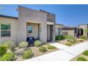 Attractive home exterior showcasing a welcoming entrance and low-maintenance desert landscaping at 924 Allister Fields Ln, Las Vegas, NV 89138