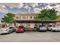 A view of the covered parking with assigned parking space numbers and multiple parked cars at 9303 Gilcrease Ave # 2198, Las Vegas, NV 89149