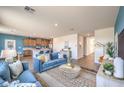 Spacious living room seamlessly connects to the modern kitchen with stainless appliances at 1013 Gentle Swan St # 696, Henderson, NV 89011