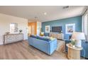 Bright living room featuring stylish decor, comfortable seating, and hardwood floors at 1013 Gentle Swan St # 696, Henderson, NV 89011