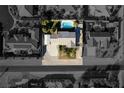 Bird's eye view featuring the backyard pool area and covered parking of this desert home at 10140 W Tropical Pkwy, Las Vegas, NV 89149