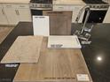 Interior design selection board featuring Alabaster paint, Benton Burlap cabinets, and Liberty Calacatta quartz countertop at 10315 Water Knot Ave, Las Vegas, NV 89166