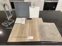 Sample kitchen design featuring luxury vinyl plank flooring, quartz countertops, and upgraded grey cabinets at 156 Silver Run Ln, Las Vegas, NV 89138