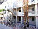 Apartment building with exterior staircase, showcasing a practical and accessible design at 2044 Mesquite Ln # 301, Laughlin, NV 89029