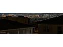Stunning Las Vegas city view from property featuring a rooftop view and sparkling cityscape in the distance at night at 2246 Bird Of Prey St, Las Vegas, NV 89138