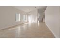 Bright living room featuring tile floors and a neutral color palette at 2455 Silver Blossom Ln, Henderson, NV 89052