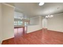 Spacious living room with hardwood floors, crown molding, and large windows offering plenty of natural light at 2520 Eclipsing Stars Dr, Henderson, NV 89044