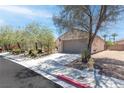 Inviting single-Gathering home with a spacious driveway, desert landscaping, and a two-car garage at 2799 Alnwick Ct, Henderson, NV 89044
