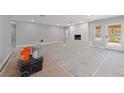Spacious, bright living space features a fireplace, recessed lighting, and access to the yard at 3075 Santa Margarita St, Las Vegas, NV 89146