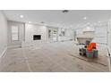 Bright living space features a fireplace, recessed lighting, and open kitchen area at 3075 Santa Margarita St, Las Vegas, NV 89146