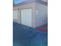 A two-car garage with white doors and a 
