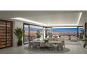 Modern dining area with city views, stylish lighting, and an elegant wine storage unit at 400 Rock Peak Dr # 2301, Henderson, NV 89012
