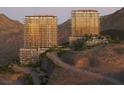 Exterior shot of luxury condos nestled in the hills, showcasing the property's unique architecture at 400 Rock Peak Dr # 2301, Henderson, NV 89012