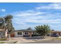 Inviting single-story home featuring a manicured lawn and a cozy entrance under a bright sky at 417 Freeman Ave, Las Vegas, NV 89106