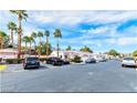 A street view shows several homes with desert landscaping and parked cars along the road at 5165 Briar Meadow Way, Las Vegas, NV 89118
