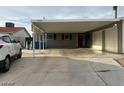 Front exterior of home with a covered carport and a car parked in the driveway at 5804 Balzar Ave, Las Vegas, NV 89108