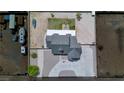 Aerial view of property showcasing home's layout, yard, and surrounding neighborhood at 6235 Westwind Rd, Las Vegas, NV 89118