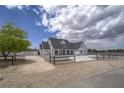 Scenic view of home with a well-maintained yard and charming curb appeal at 6235 Westwind Rd, Las Vegas, NV 89118