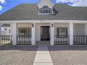 Charming front door entrance to home, complete with sidelights and house number above at 6235 Westwind Rd, Las Vegas, NV 89118