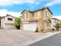 Inviting two-story home featuring a spacious driveway and attached two-car garage at 7863 Warwickshire Way, Las Vegas, NV 89139